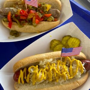 Gordy's Hi-Hat diner dogs and brats served with all the fresh toppings and a side of pickles, prepared by the all new Food Truck serving Wisconsin and Minnesota.