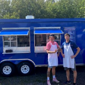 The team at Gordy's Hi-Hat stands proudly beside their Food Truck, ready to serve Wisconsin and Minnesota private parties, events and catered banquets.